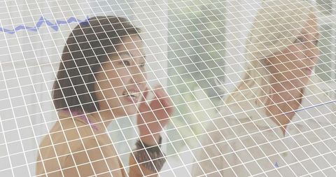 Smiling professional raising hand during business meeting with colleague and data overlay