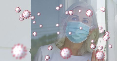 Senior woman in mask observing virus particles concept