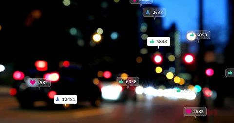Urban Night Social Media Reactions Floating Over Blurred City Street Bokeh Lights