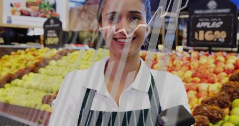 Smiling produce clerk scanning with handheld scanner and sales growth chart overlay
