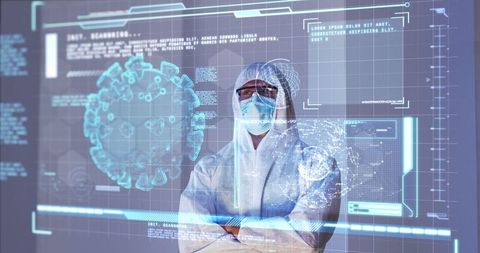 Scientist analyzing covid-19 data with advanced digital displays