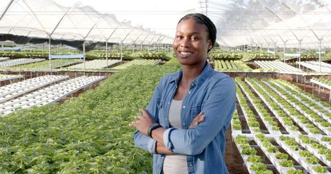 Woman confidently overseeing hydroponic farm operations