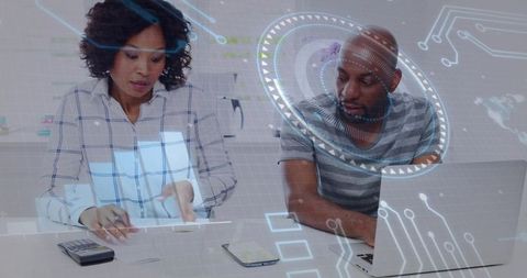 Colleagues collaborating with laptop and calculator using augmented reality hud data visualization