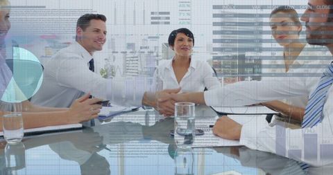 Diverse Business Team Shaking Hands in Data-Driven Meeting - Download Free Stock Images Pikwizard.com
