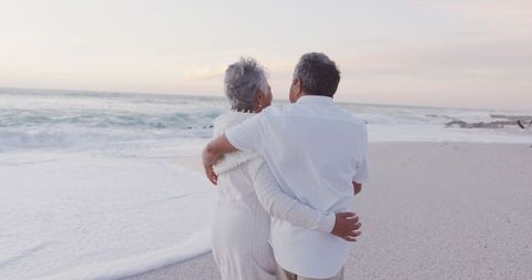 Rear View of Senior Couple Embracing on Tranquil Beach - Download Free Stock Images Pikwizard.com