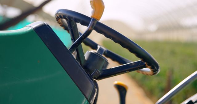 Close-Up of Steering Wheel in Agricultural Greenhouse - Download Free Stock Images Pikwizard.com