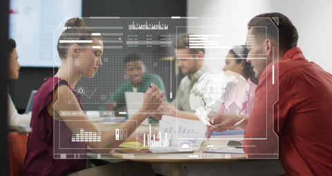 Diverse Team Using Technology in Modern Business Meeting