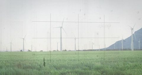 Wind Turbines in Green Field With Futuristic Overlay