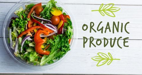 Fresh organic vegetable salad bowl on wooden table