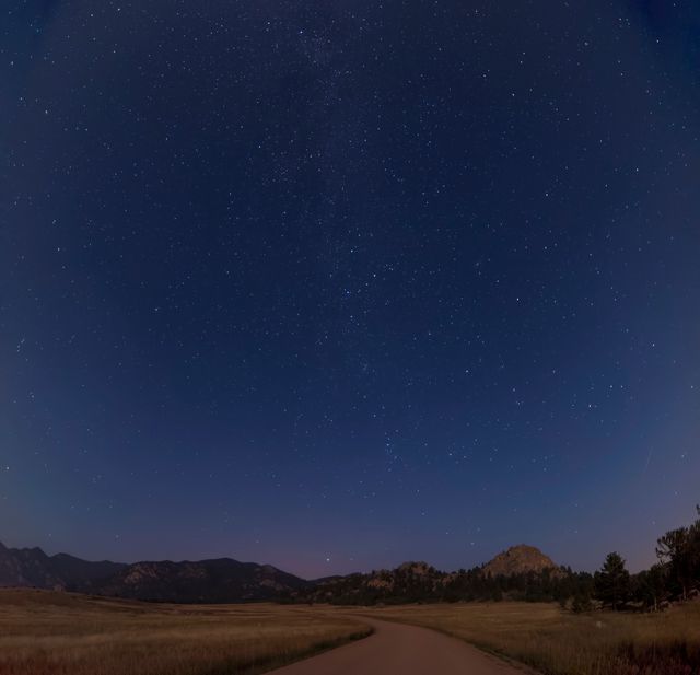 Starry Night Sky Over Mountain Road in Remote Countryside - Download Free Stock Photos Pikwizard.com