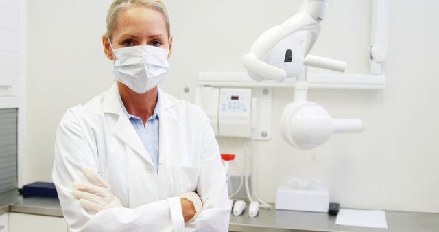 Confident Female Dentist in Surgical Mask in Modern Clinic - Download Free Stock Images Pikwizard.com