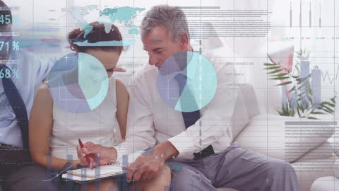 Colleagues Analyzing Reports with Financial Data Overlays