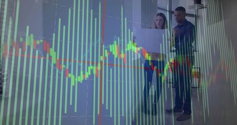 Coworkers analyzing stock data in modern office