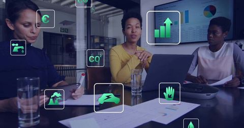 Team Collaborating on Innovative Sustainability Strategy Using Technology