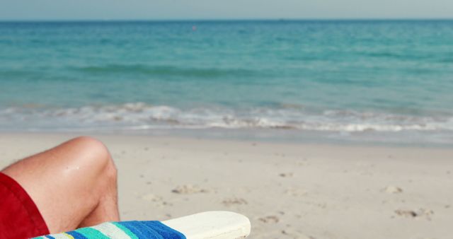 Relaxing Beach Day with Close-up of Seated Person in a Lounge Chair - Download Free Stock Images Pikwizard.com