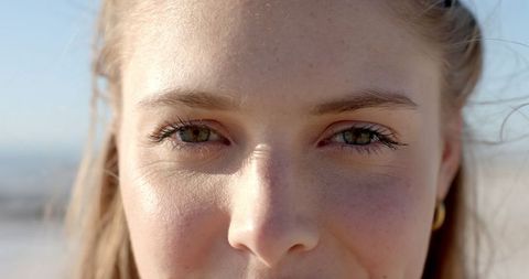 Close-Up of Contemplative Young Woman Outdoors in Natural Light