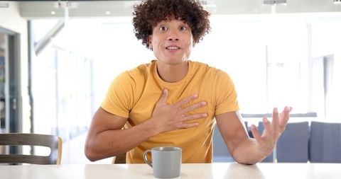 Passionate Man Communicating at Home with Gestures