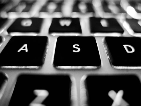Close-up view of black technology laptop keyboard in black and white