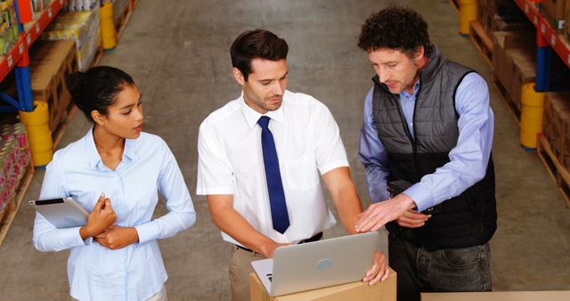 Warehouse Manager Discussing Logistics with Warehouse Staff - Download Free Stock Images Pikwizard.com