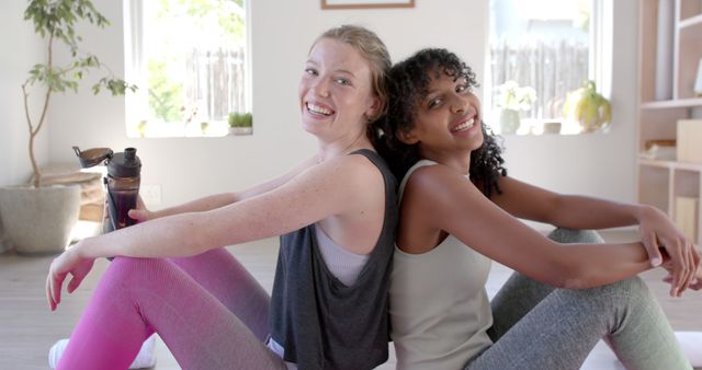 Two Happy Women Relaxing After a Workout Session - Download Free Stock Images Pikwizard.com