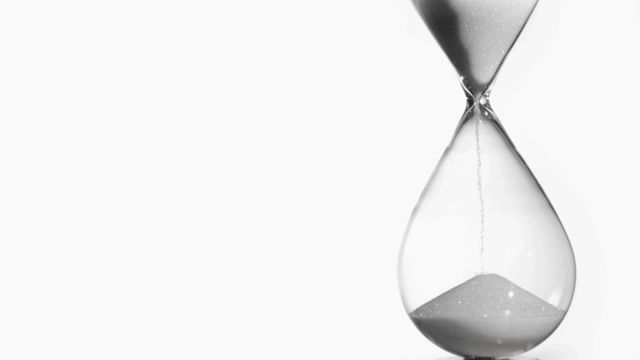 Elegant representation of time with white sand delicately falling through a glass hourglass. Highlights concepts such as passing time, countdown, and urgency with a minimalist appeal. Ideal for themes related to business and project management, and for illustrating ideas in areas like philosophy, mindfulness, or productivity tools.