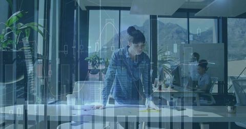 Focused Project Manager Analyzing Workplace Data