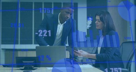 Business professionals analyzing data with digital technology overlay