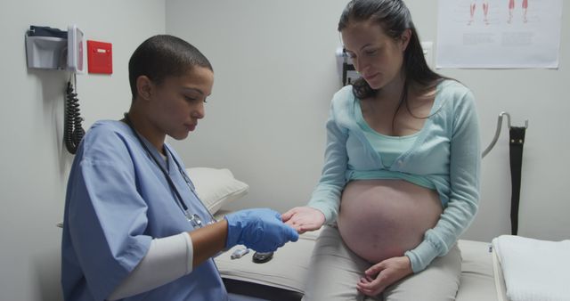 Pregnant Woman Receiving Medical Checkup from Nurse in Clinic - Download Free Stock Images Pikwizard.com