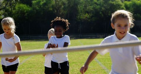 Children Enjoying Outdoor Tug-of-War Game