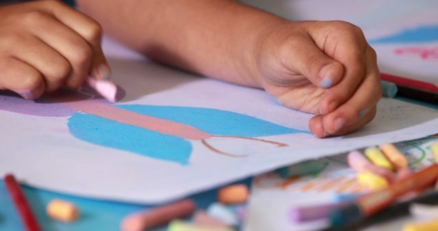 Child Drawing with Colorful Chalk on Paper - Download Free Stock Images Pikwizard.com