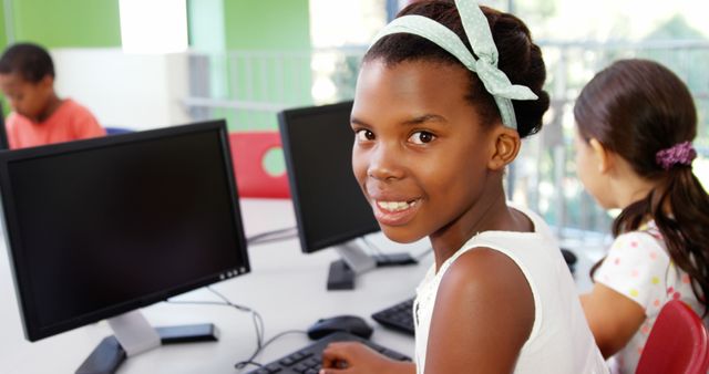 Group of students in classroom learning about computers. Perfect for educational websites, back-to-school promotions, technology tutorials, and school brochures. Highlights important themes such as education, youth, technology, and digital literacy.