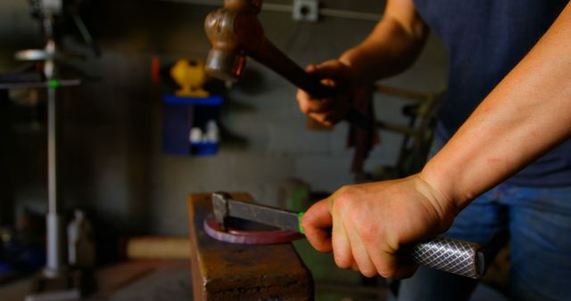 Close-Up of Blacksmith Hammering Metal in Workshop - Download Free Stock Images Pikwizard.com