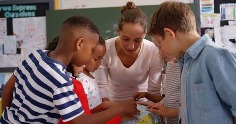 Teacher Engaging Diverse Students with Globe in Classroom - Download Free Stock Images Pikwizard.com