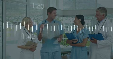 Medical Team Discussing X-ray for Diagnosis in Hospital Corridor