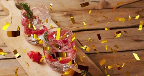Festive celebration with strawberry infused water and falling confetti