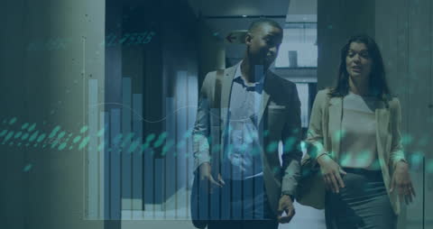 Diverse Colleagues Analyzing Business Graphics in Modern Office Setting