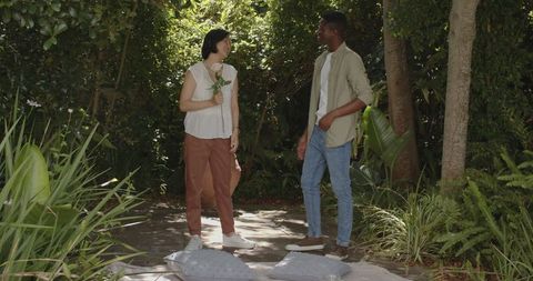 Couple Enjoying Relaxing Garden Picnic with Fruit