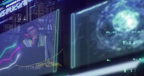 Digital data analysis with technician in neon-lit server room