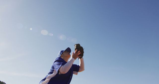 Baseball Player Catching Ball in Bright Blue Sky - Download Free Stock Images Pikwizard.com