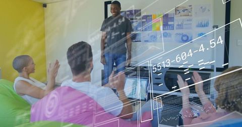 Innovative startup team collaborating with digital data interface