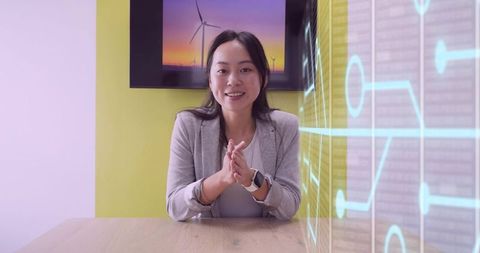 Confident Asian Businesswoman Presenting Innovative Technology Strategy