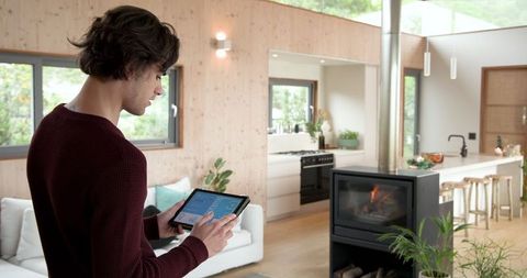 Man Using Tablet in Modern Cozy Living Kitchen Space