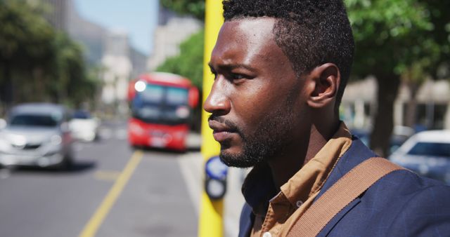 Pensive Young Man Waiting on Busy City Street - Download Free Stock Images Pikwizard.com