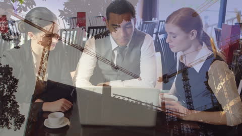 Multiracial Engineers Discussing Construction Plans in Modern Office