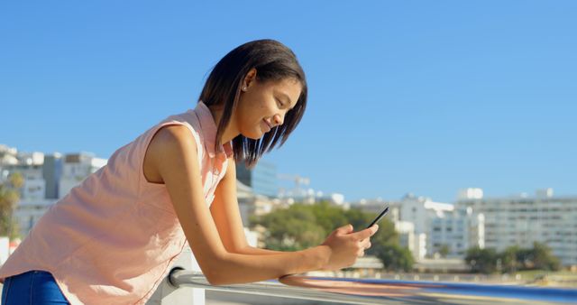 Young Woman Texting on Smartphone Outdoors on Sunny Day - Download Free Stock Images Pikwizard.com