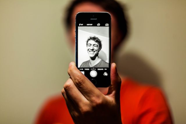 Person Taking Selfie with Smartphone Showing Smiling Face - Download Free Stock Photos Pikwizard.com