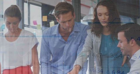 Team Analyzing Stock Market Data in Modern Office Environment