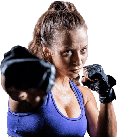 Determined female fighter punching in athletic stance transparent background
