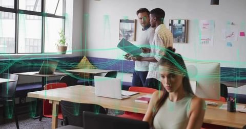 Professionals Collaborating with Data Analytics in Modern Office