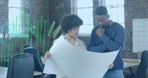 Diverse Architects Collaborating on Blueprint in Modern Office